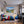 Leinwandbild Berglandschaft mit See fuer Jugendzimmer warmeFarben Querformat