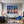 Leinwandbild Bunte Gitarren in der Stadt fuer Wohnzimmer blau Querformat