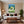 Leinwandbild Dynamischer Tennis-Moment fuer Wohnzimmer warmeFarben Hochformat