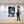 Leinwandbild Entspanntes Löwenbaby im Glas 80x120 cm Hochformat