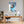 Leinwandbild Entspanntes Nashorn im Glas fuer Buero und Arbeitszimmer warmeFarben Hochformat