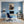 Leinwandbild Kaffeegenuss mit einem kleinen Elefanten fuer Buero und Arbeitszimmer blau Hochformat