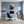 Leinwandbild Kaffeegenuss mit einem kleinen Elefanten fuer Buero und Arbeitszimmer blau Hochformat