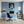 Leinwandbild Verspielter Leopard im Wasser fuer Buero und Arbeitszimmer blau Hochformat