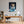 Leinwandbild Verspielter Leopard im Wasser fuer Buero und Arbeitszimmer warmeFarben Hochformat