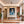 Leinwandbild Verspielter Leopard im Wasser fuer Flur und Eingang warmeFarben Hochformat