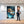 Poster Wandbild 100x150 cm Entspanntes Löwenbaby im Glas Hochformat