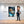 Poster Wandbild 80x120 cm Entspanntes Löwenbaby im Glas Hochformat