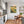 Poster Wandbild Blühende Wiesen im Sonnenuntergang fuer Kueche und Esszimmer grauoderbeige Hochformat