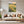 Poster Wandbild Blühende Wiesen im Sonnenuntergang fuer Wohnzimmer grauoderbeige Hochformat