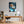 Poster Wandbild Entspanntes Löwenbaby im Glas fuer Buero und Arbeitszimmer warmeFarben Hochformat