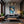 Poster Wandbild Entspanntes Löwenbaby im Glas fuer Wohnzimmer dunkelanthrazit Hochformat