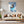 Poster Wandbild Entspanntes Nashorn im Glas fuer Wohnzimmer grauoderbeige Hochformat