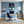 Poster Wandbild Kleiner Leopard im Wasser fuer Buero und Arbeitszimmer blau Hochformat