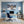 Poster Wandbild Schneeleopard im Winterwunderland fuer Büro- und Arbeitszimmer blau Querformat
