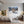 Poster Wandbild Schneeleopard im Winterwunderland fuer Jugendzimmer grauoderbeige Querformat
