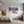Poster Wandbild Schneeleopard im Winterwunderland fuer Jugendzimmer grauoderbeige Querformat