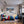 Poster Wandbild Schneeleopard im Winterwunderland fuer Jugendzimmer warmeFarben Querformat