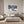 Poster Wandbild Schneeleopard im Winterwunderland fuer Schlafzimmer grauoderbeige Querformat