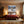 Poster Wandbild Schneeleopard im Winterwunderland fuer Schlafzimmer warmeFarben Querformat