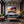 Poster Wandbild Sonnenuntergang mit Bougainvillea fuer Wohnzimmer dunkelanthrazit Querformat