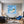 Poster Wandbild Traumhafte Seifenblase am Strand fuer Wohnzimmer blau Quadrat