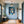 Poster Wandbild Verspielte Freude im Glas fuer Flur und Eingang blau Hochformat