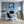 Poster Wandbild Verspielter Elefant im Glas fuer Buero und Arbeitszimmer blau Hochformat