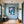 Poster Wandbild Verspielter Elefant im Glas fuer Flur und Eingang blau Hochformat