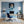 Poster Wandbild Verspielter Leopard im Wasser fuer Buero und Arbeitszimmer blau Hochformat