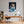 Poster Wandbild Verspielter Leopard im Wasser fuer Buero und Arbeitszimmer warmeFarben Hochformat