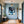 Poster Wandbild Verspielter Panther im Wasser fuer Flur und Eingang blau Hochformat