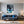 Poster Wandbild Verspielter Panther im Wasser fuer Wohnzimmer blau Hochformat
