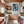 Poster Wandbild Verspielter Schimpanse im Wasser fuer Kueche und Esszimmer warmeFarben Hochformat