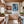 Poster Wandbild Verspielter Schimpanse im Wasser fuer Kueche und Esszimmer warmeFarben Hochformat