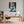Poster Wandbild Verspieltes Zebra im Wasser fuer Buero und Arbeitszimmer warmeFarben Hochformat